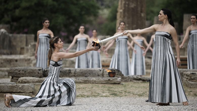 Paris 2024 Olympics - Olympic Flame Lighting Ceremony - Ancient Olympia, Greece - April 16, 2024 Greek actress Mary Mina, playing the role of High Priestess, lights the flame during the Olympic Flame lighting ceremony for the Paris 2024 Olympics. REUTERS/Alkis Konstantinidis