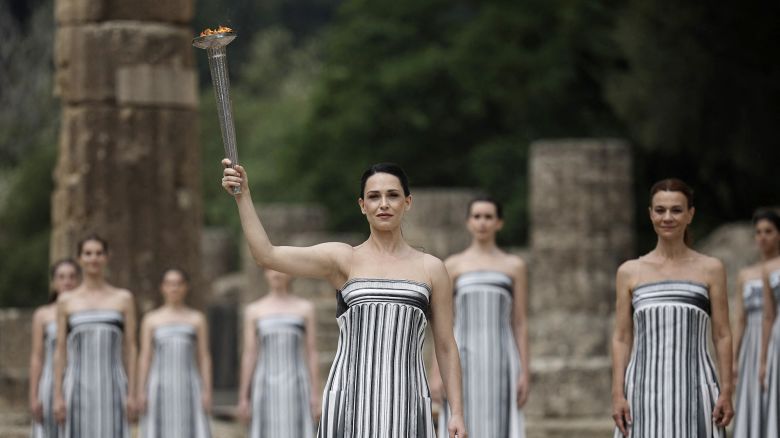 Greek actress Mary Mina, playing the role of High Priestess, carries the torch during the Olympic Flame lighting ceremony for the Paris 2024 Olympics.