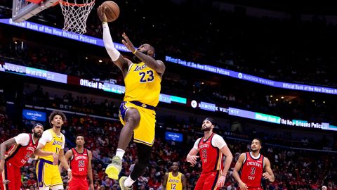 Apr 16, 2024; New Orleans, Louisiana, USA; Los Angeles Lakers forward LeBron James (23) shoots against New Orleans Pelicans forward Larry Nance Jr. (22) during the second half of a play-in game of the 2024 NBA playoffs at Smoothie King Center. Mandatory Credit: Stephen Lew-USA TODAY Sports