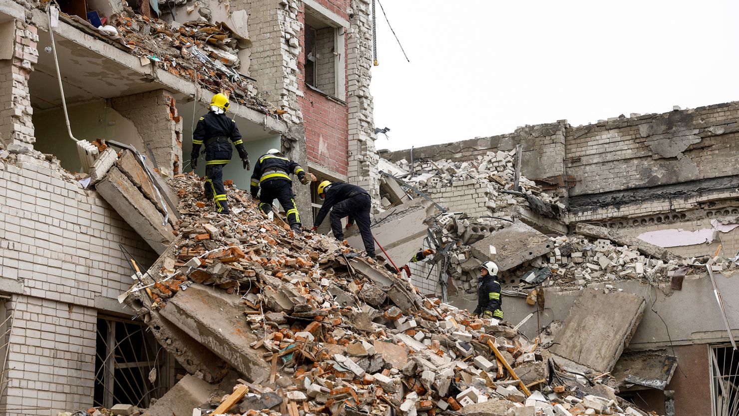Rescuers work at a building destroyed by a Russian missile strike in Chernihiv, Ukraine, April 17, 2024.