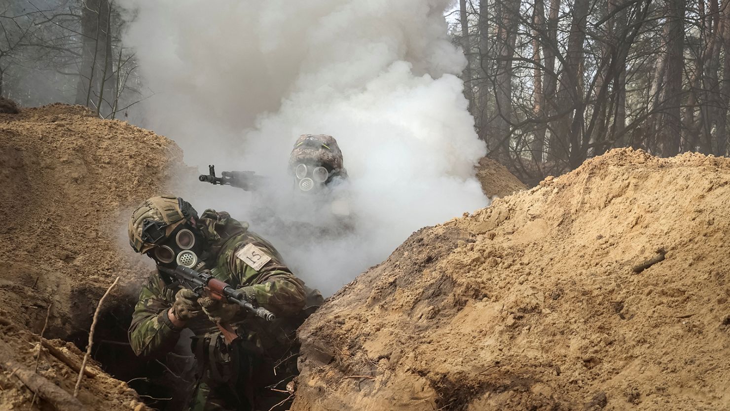 Ukrainian soldiers take part in radiation, chemical and biological hazard drills near Kharkiv, Ukraine, on February 29, 2024.