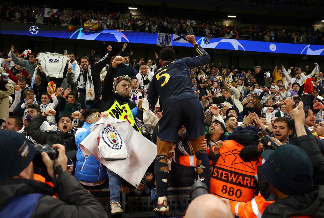 Jude Bellingham celebrates with Real Madrid fans after winning the Champions League quarterfinal against Manchester City.