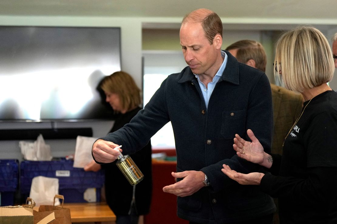 The prince is shown items by charity operations director Claire Hopkins during the engagement at the surplus food redistribution charity. 