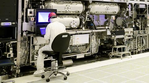 Workers are seen in front of a "High NA EUV" lithography system at an Intel facility in Hillsboro, Oregon, U.S. in this handout image obtained by Reuters on April 19, 2024.