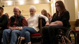 Sue Townsend holds hands with Anne Marie Hochhalter during a vigil on the eve of the 25th anniversary of the Columbine High School massacre. Hochhalter died February 16, 2025.
