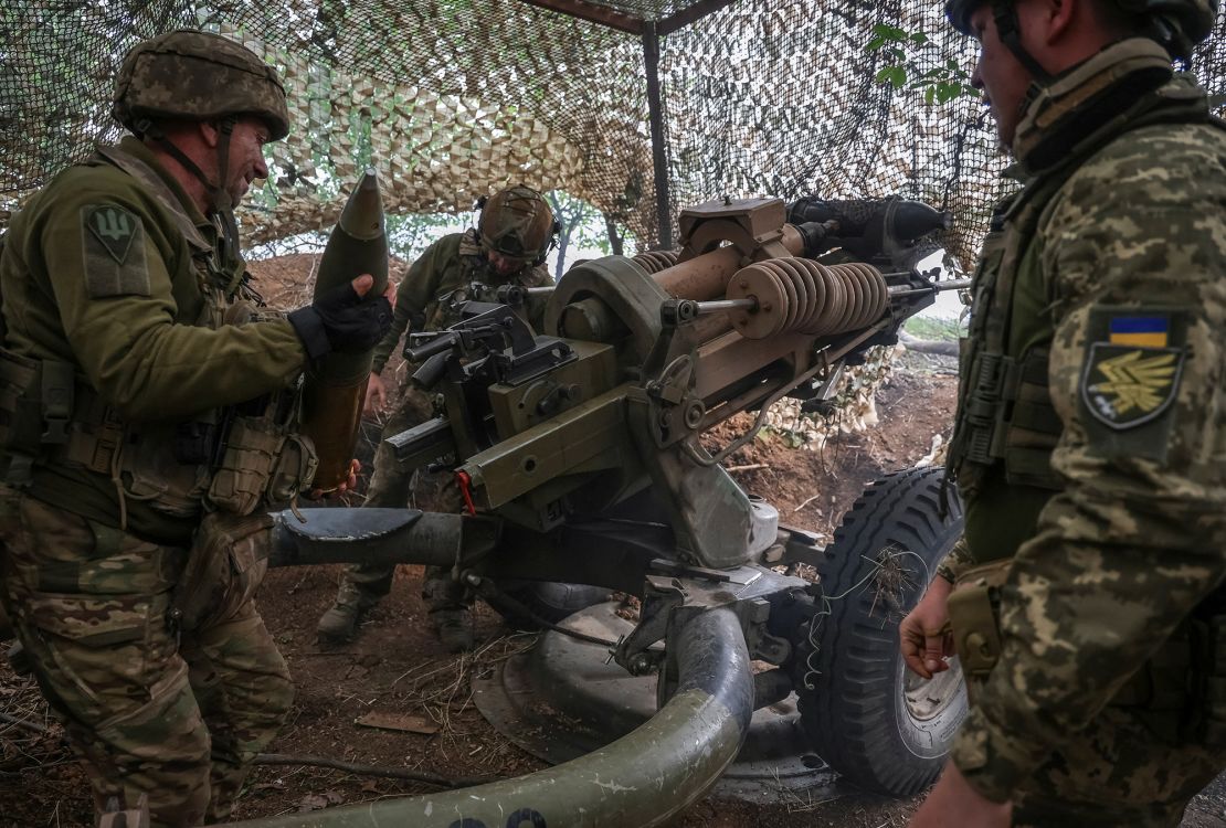 Ukrainian service members fire a L119 howitzer towards Russian troops, in Donetsk region, Ukraine April 21, 2024.