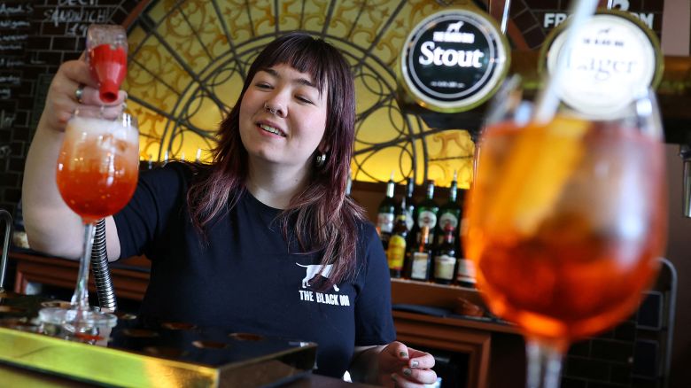 Bar supervisor Hattie makes an 'Aperol Spritz (Taylor's Version)' drink at The Black Dog pub, believed by its owners to have been referenced in lyrics in the song The Black Dog by Taylor Swift, in London, Britain, April 22, 2024. REUTERS/Toby Melville
