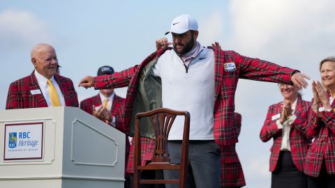 Scottie Scheffler is fitted with his plaid jacket after winning the 2024 RBC Heritage.