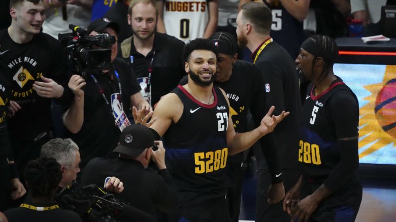 Apr 22, 2024; Denver, Colorado, USA; Denver Nuggets guard Jamal Murray (27) reacts after defeating the Los Angeles Lakers during game two during the 2024 NBA playoffs at Ball Arena. Mandatory Credit: Ron Chenoy-USA TODAY Sports