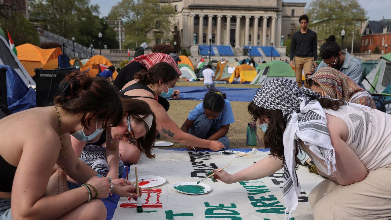 Students at Columbia University paint a response to a message written by Palestinians in Rafah thanking students for their support as they continue to maintain a protest encampment on campus in support of Palestinians, during the ongoing conflict between Israel and the Palestinian Islamist group Hamas, in New York City, U.S., April 28, 2024.