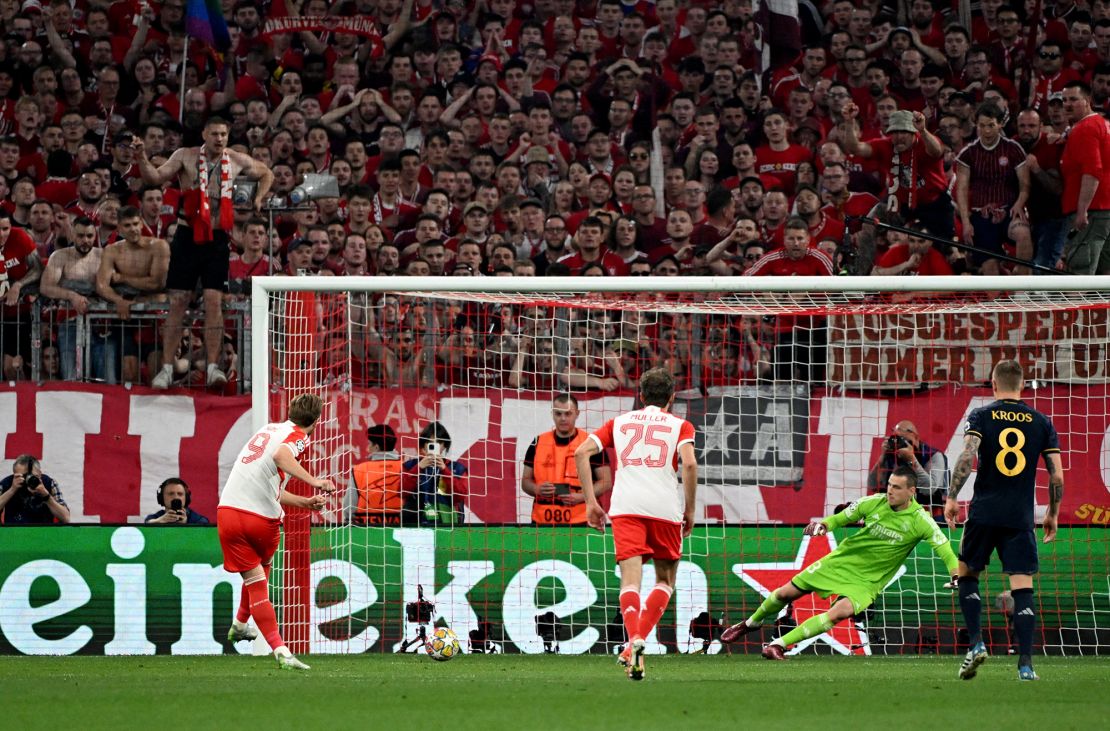 Harry Kane scores a penalty to give Bayern Munich the lead in the game.