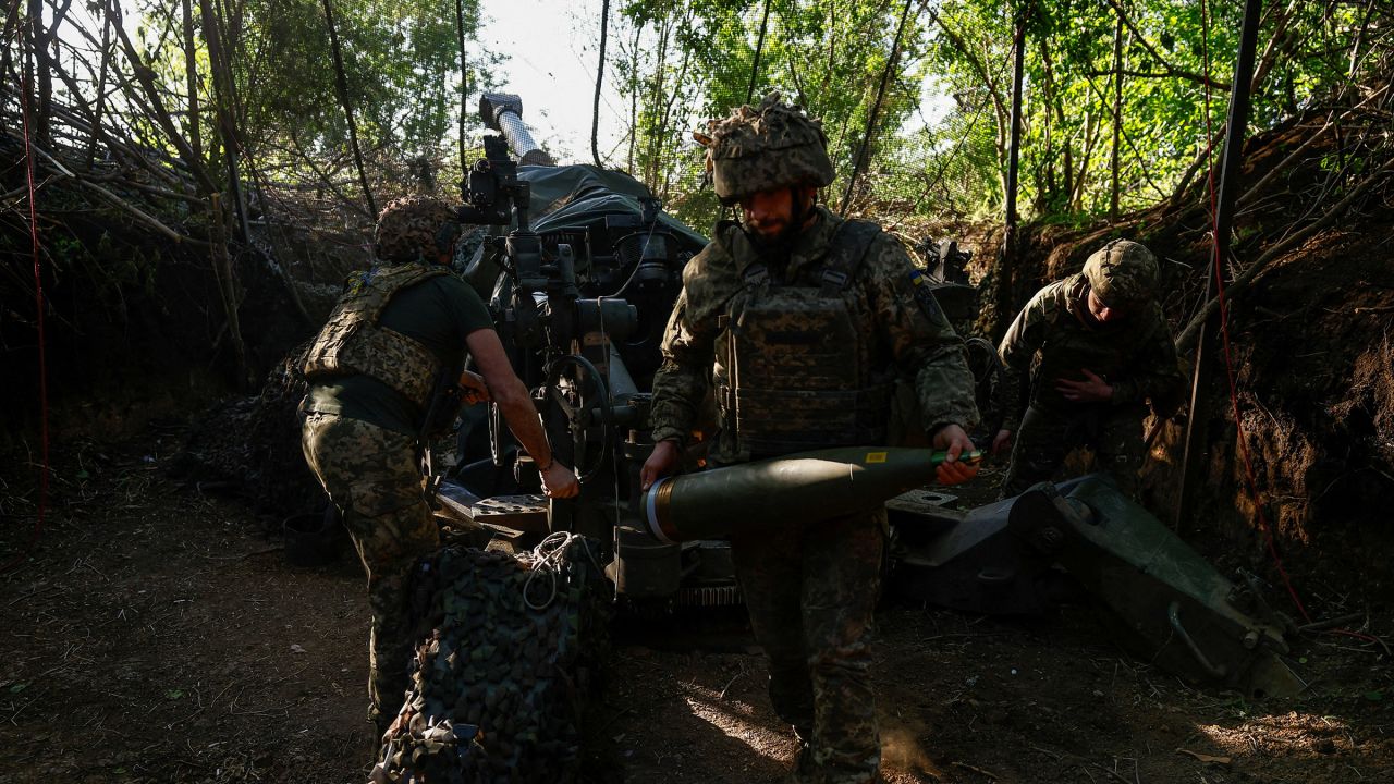 Ukrainian servicemen fire a M777 howitzer toward Russian troops near a front line in the Donetsk region, Ukraine on May 1, 2024. FBI officials are concerned that President Joe Biden's backing of Ukraine may lead Russia to take more risks in interfering in the 2024 presidential election.