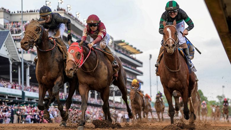 May 4, 2024; Louisville, KY, USA; Mystik Dan (right) wins the Kentucky Derby in a photo finish at Churchill Downs. Forever Young, with Ryusei Sakai up (middle) finished third and Sierra Leone (left) with Tyler Gaffalione up, finished second. Mandatory Credit: Michael Clevenger and Christopher Granger-USA TODAY Sports