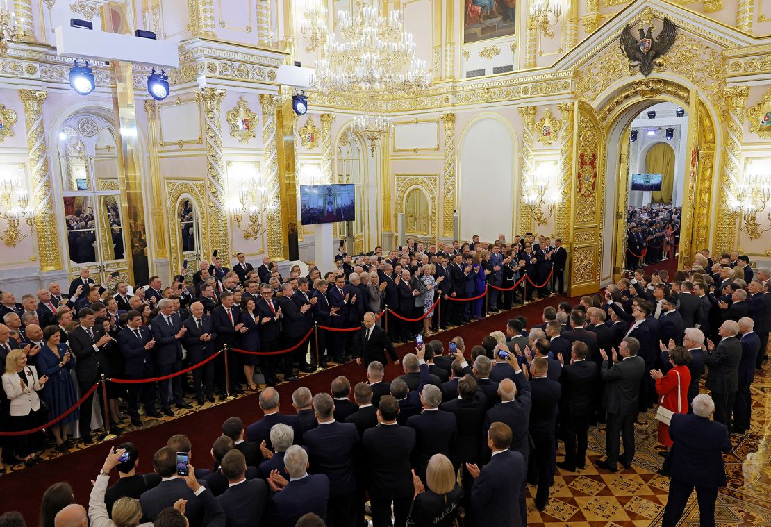 Attendees wait in the Kremlin as Putin arrives for his inauguration ceremony.