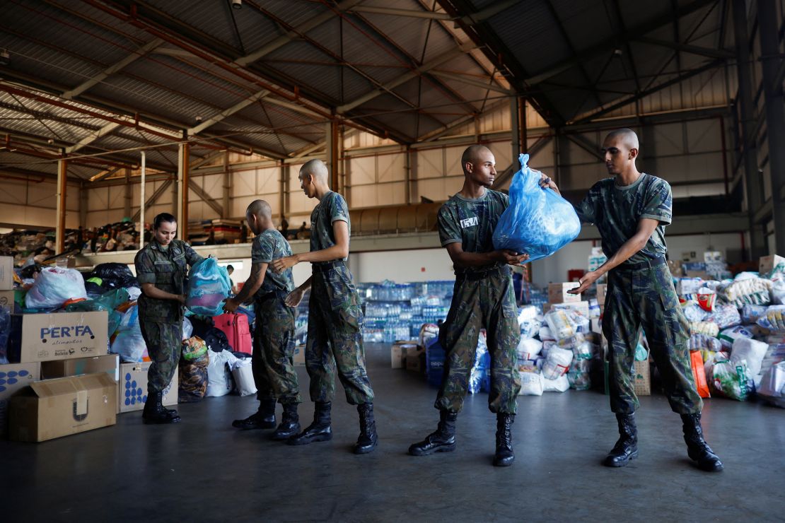 Brazilian Air Force Soldiers prepare donations for flood victims at the Brasilia Air Force Base.