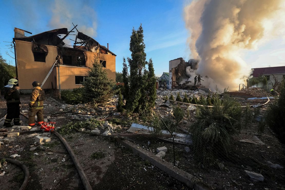 Firefighters at the site of a Russian missile strike in Kharkiv, Ukraine, on May 10, 2024.