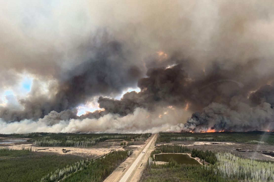 Smoke rises from a fire near Indian Cabins, Alberta, Canada, on Friday. This fire originated from the Northwest Territories in 2023 but flared up again in recent days due to strong winds and burned south into Alberta.