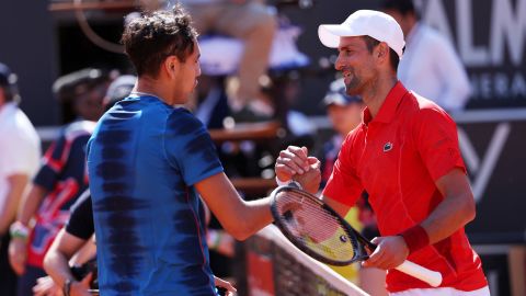 Tennis - Italian Open - Foro Italico, Rome, Italy - May 12, 2024 Serbia's Novak Djokovic and Chile's Alejandro Tabilo shake hands at the net after Tabilo won their round of 32 match