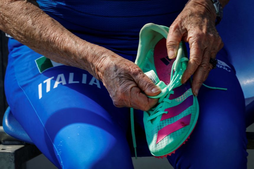 Mazzenga putting on her running shoes before a race.