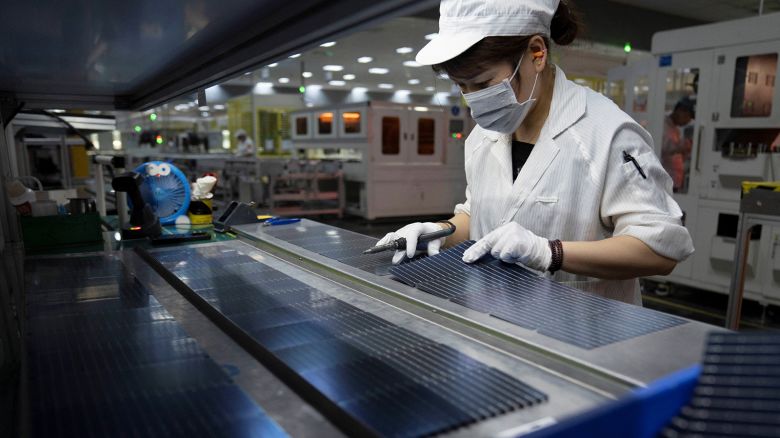 An employee works on the production line for solar panels at a factory of GCL System Integration Technology in Hefei, Anhui province, China May 16, 2024.