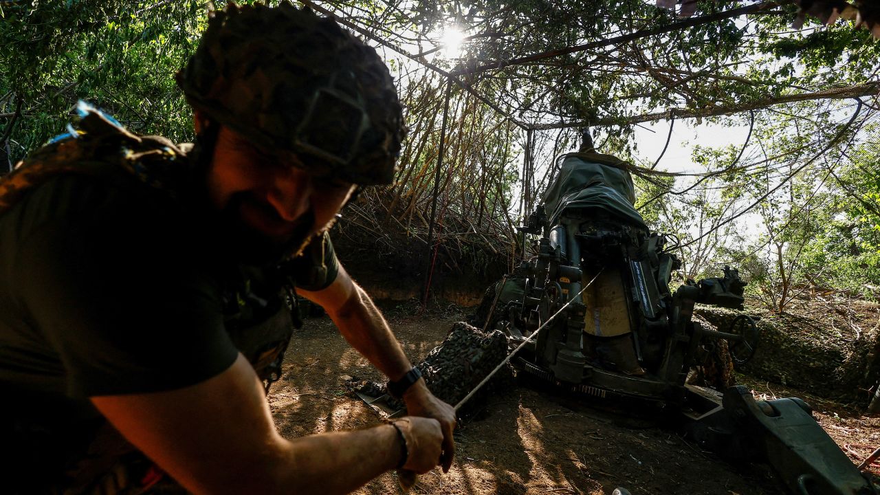 A Ukrainian serviceman of the 148th Separate Artillery Brigade of the Ukrainian Air Assault Forces, fires a M777 howitzer toward Russian troops near a front line, amid Russia’s attack on Ukraine, in Donetsk region, Ukraine May 1, 2024.