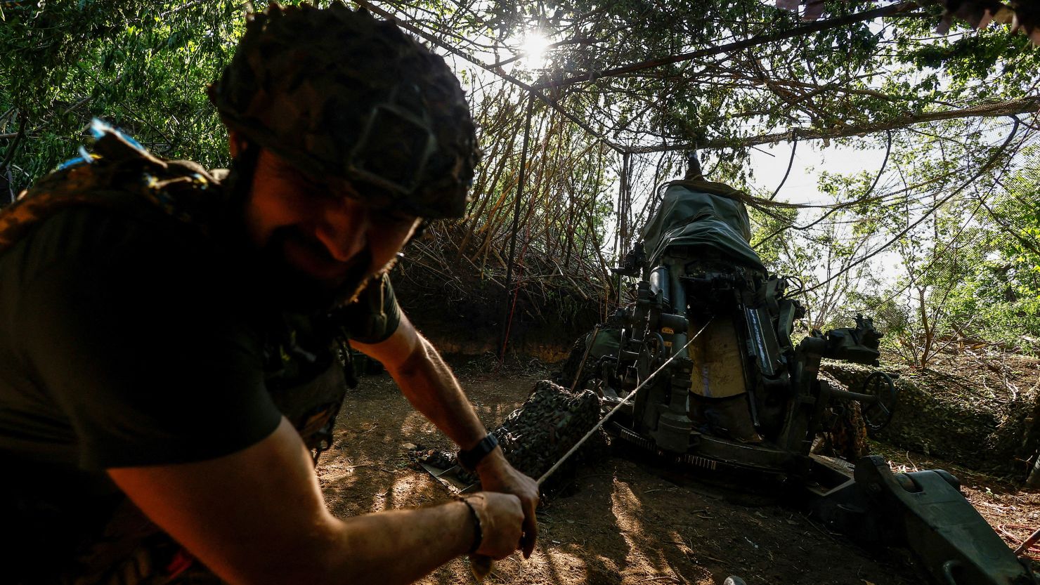 A Ukrainian serviceman of the 148th Separate Artillery Brigade of the Ukrainian Air Assault Forces, fires toward Russian troops near a front line, amid Russia’s attack on Ukraine, in Donetsk region, Ukraine May 1, 2024.