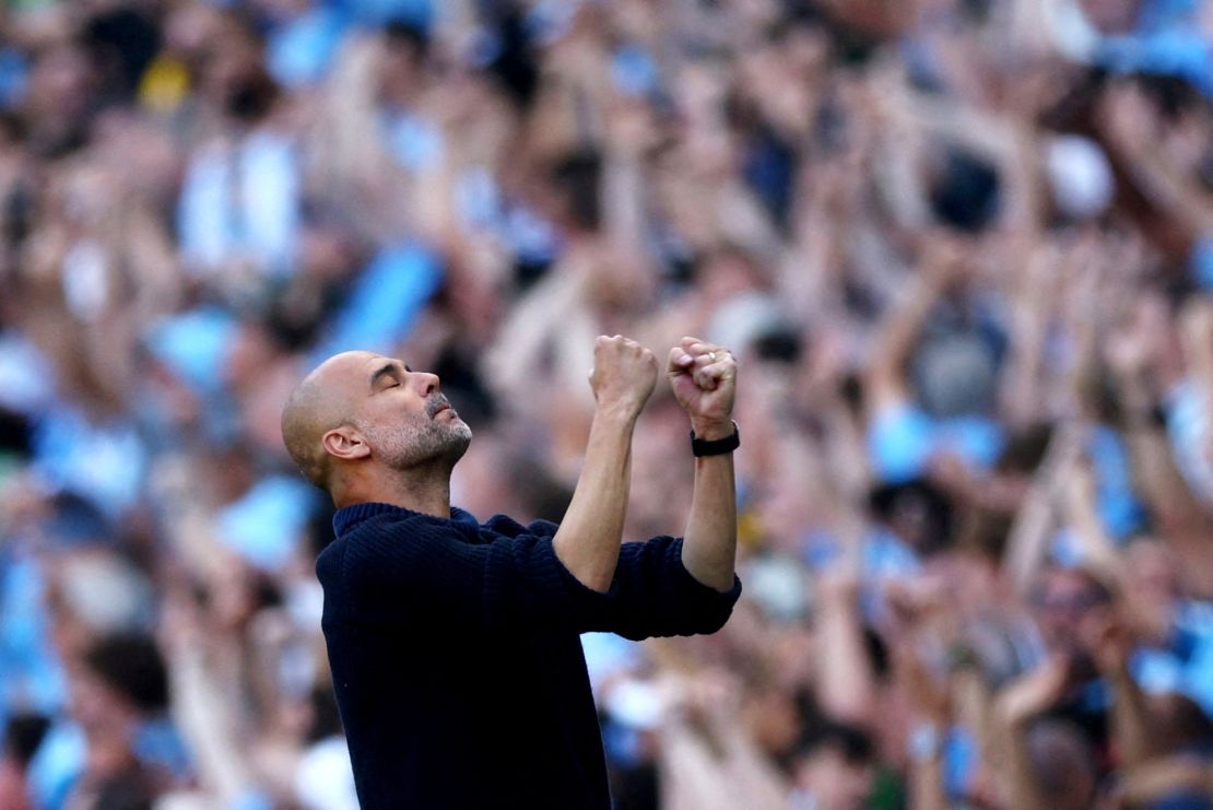 Pep Guardiola celebrates Manchester City's second goal.