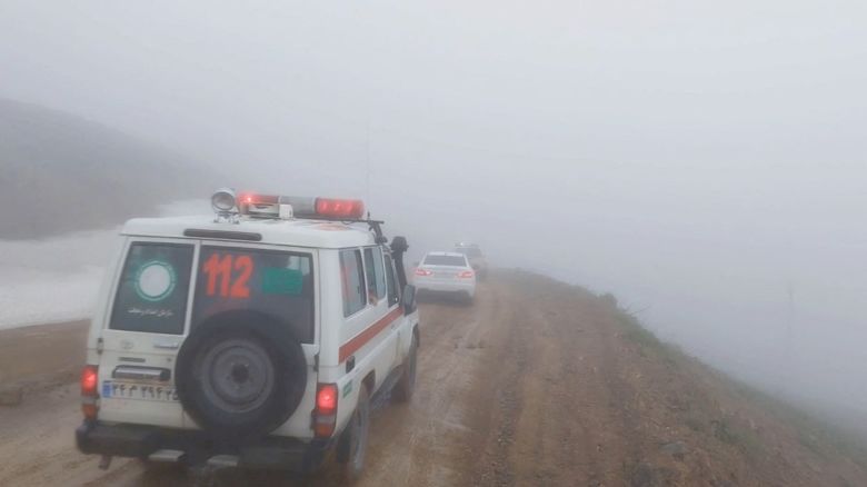 In this still from a video, an ambulance and other vehicles drive on a foggy road following a crash of a helicopter carrying Iran's President Ebrahim Raisi, in Varzaqan, East Azerbaijan Province, Iran, May 19.