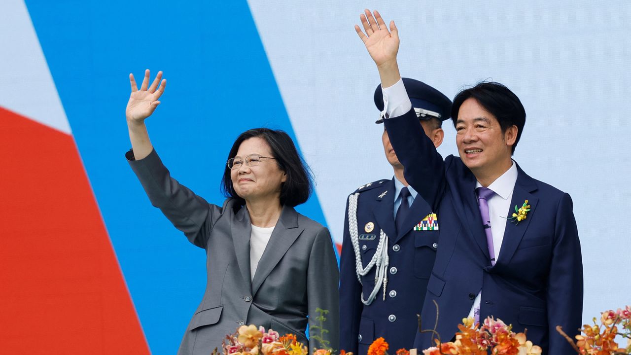 Taiwan's former President Tsai Ing-wen and new President Lai Ching-te wave to people during the inauguration ceremony outside the Presidential office building in Taipei, Taiwan May 20, 2024.
