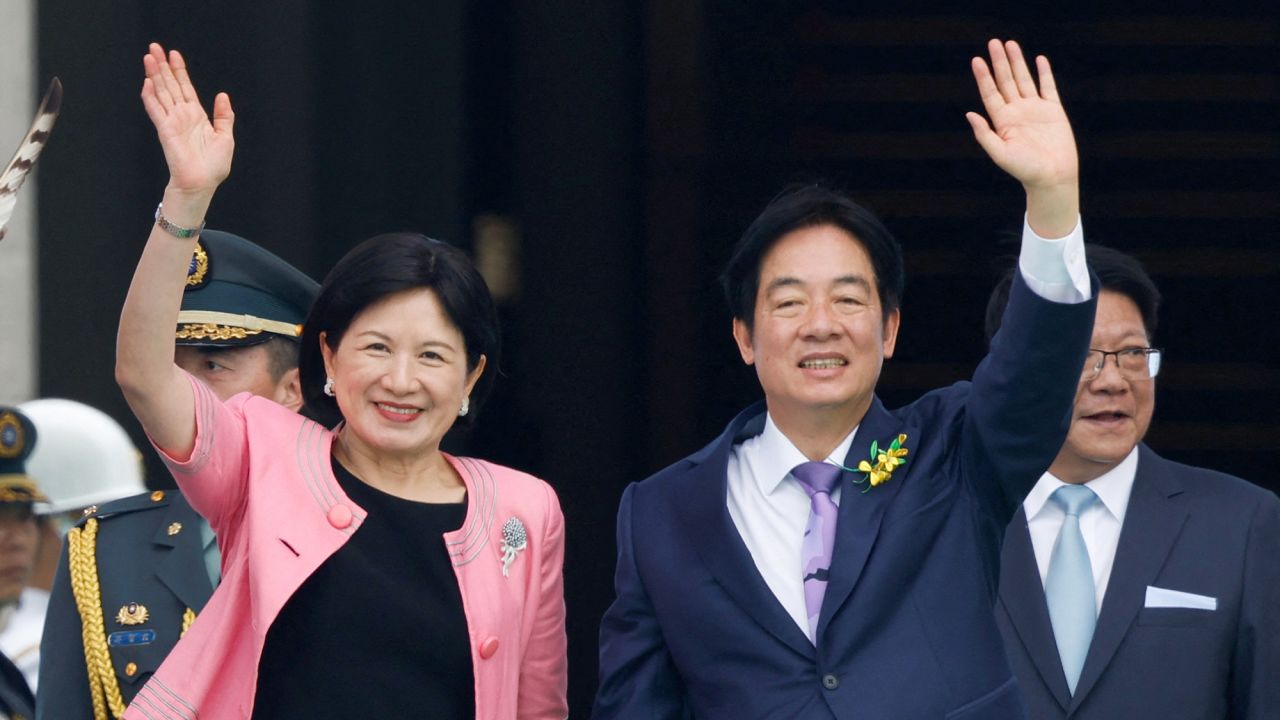 Taiwan's new President Lai Ching-te and his wife Wu Mei-ju wave during the inauguration ceremony outside the Presidential office building in Taipei, Taiwan May 20, 2024. REUTERS/Carlos Garcia Rawlins