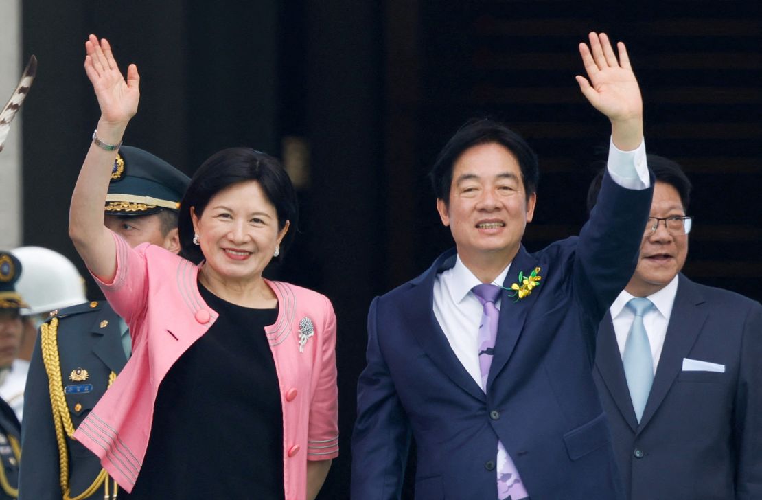 Taiwan's new President Lai Ching-te and his wife Wu Mei-ju wave during the inauguration ceremony in Taipei on May 20, 2024.