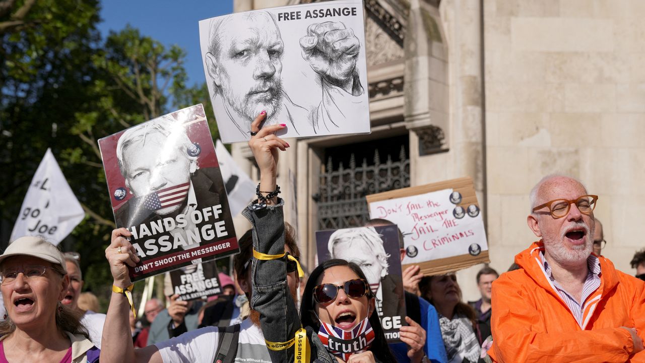 People attend a protest outside London's High Court before Julian Assange's extradition hearing on May 20.