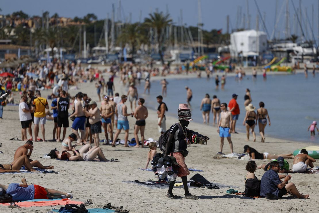 Tourists sunbathe in El Arenal beach in?Palma?de?Mallorca, Spain.