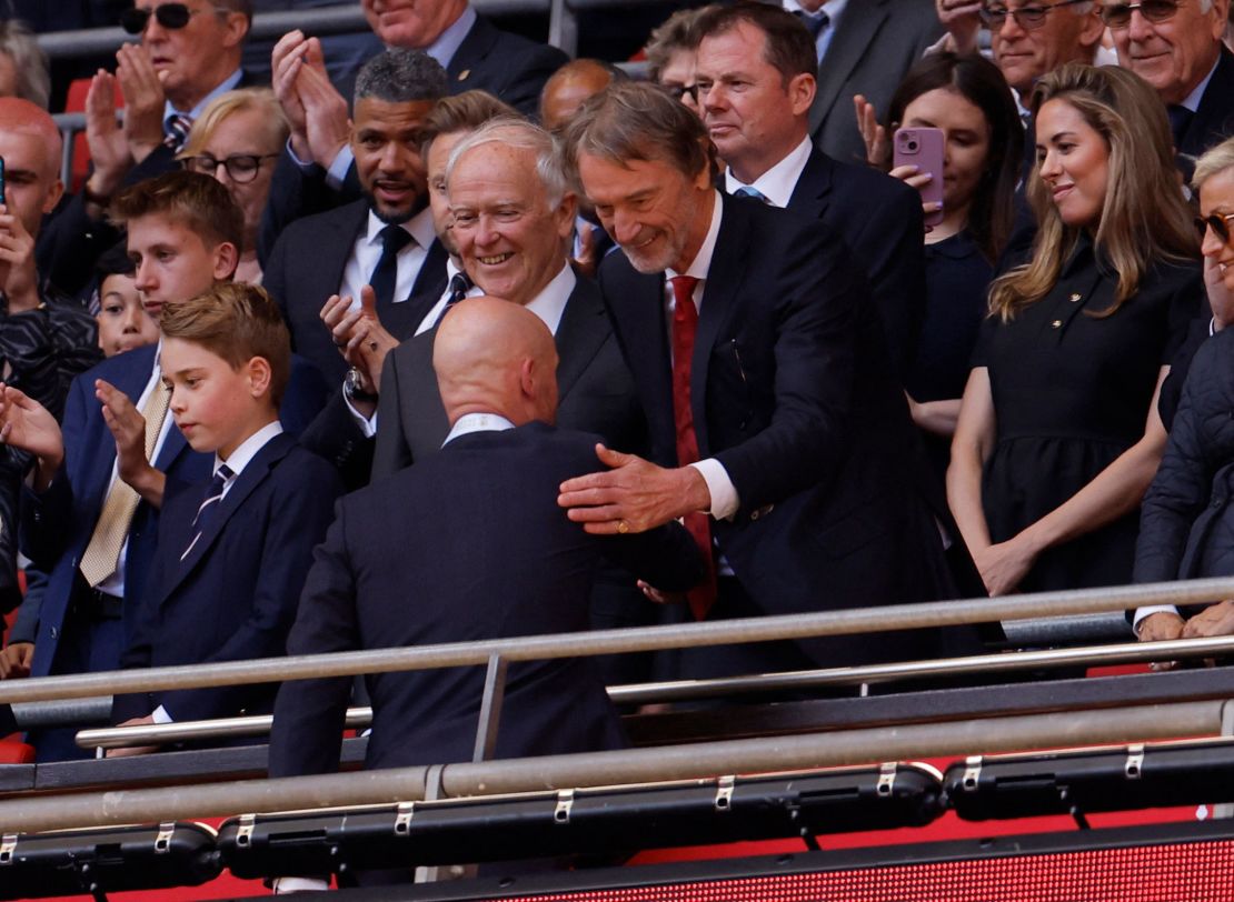 Ten Hag shakes hands with the club's new co-owner Jim Ratcliffe after winning the FA Cup last season.