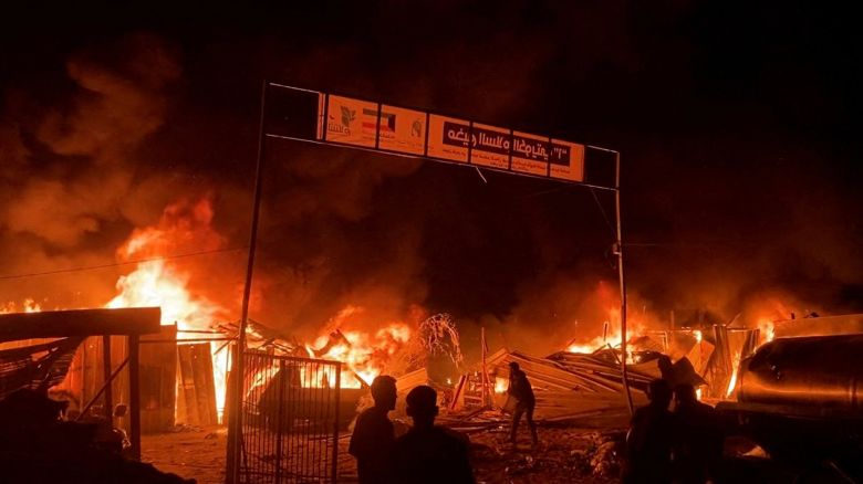 In this picture taken from a video, fire rages following an Israeli strike on an area designated for displaced Palestinians in Rafah in the southern Gaza Strip, on May 26, 2024.