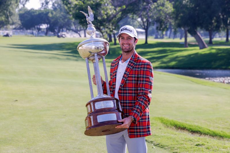 Davis Riley holds the trophy after winning the Charles Schwab Challenge.