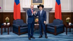 Taiwan President Lai Ching-te (right) wears a cowboy hat given to him by US Representative Michael McCaul, chairman of the House Foreign Affairs Committee, at the presidential office in Taipei?on May 27, 2024.