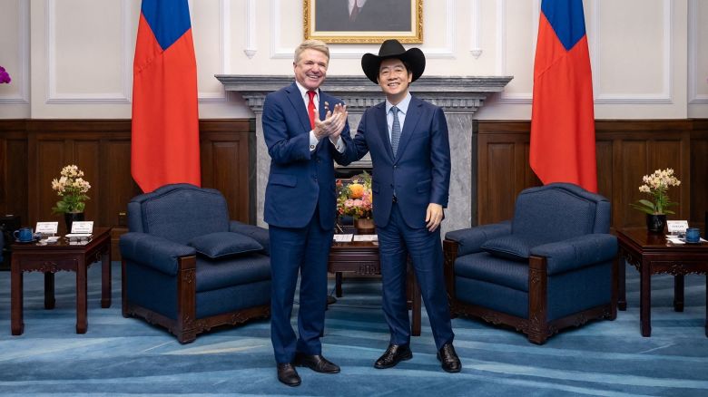 Taiwan President Lai Ching-te (right) wears a cowboy hat given to him by US Representative Michael McCaul, chairman of the House Foreign Affairs Committee, at the presidential office in Taipei on May 27, 2024.