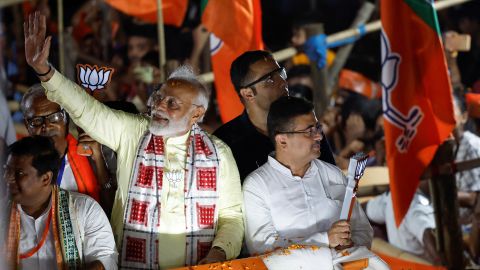 India's Prime Minister Narendra Modi waves towards his supporters during a roadshow as part of an election campaign, in Kolkata, India, May 28, 2024.