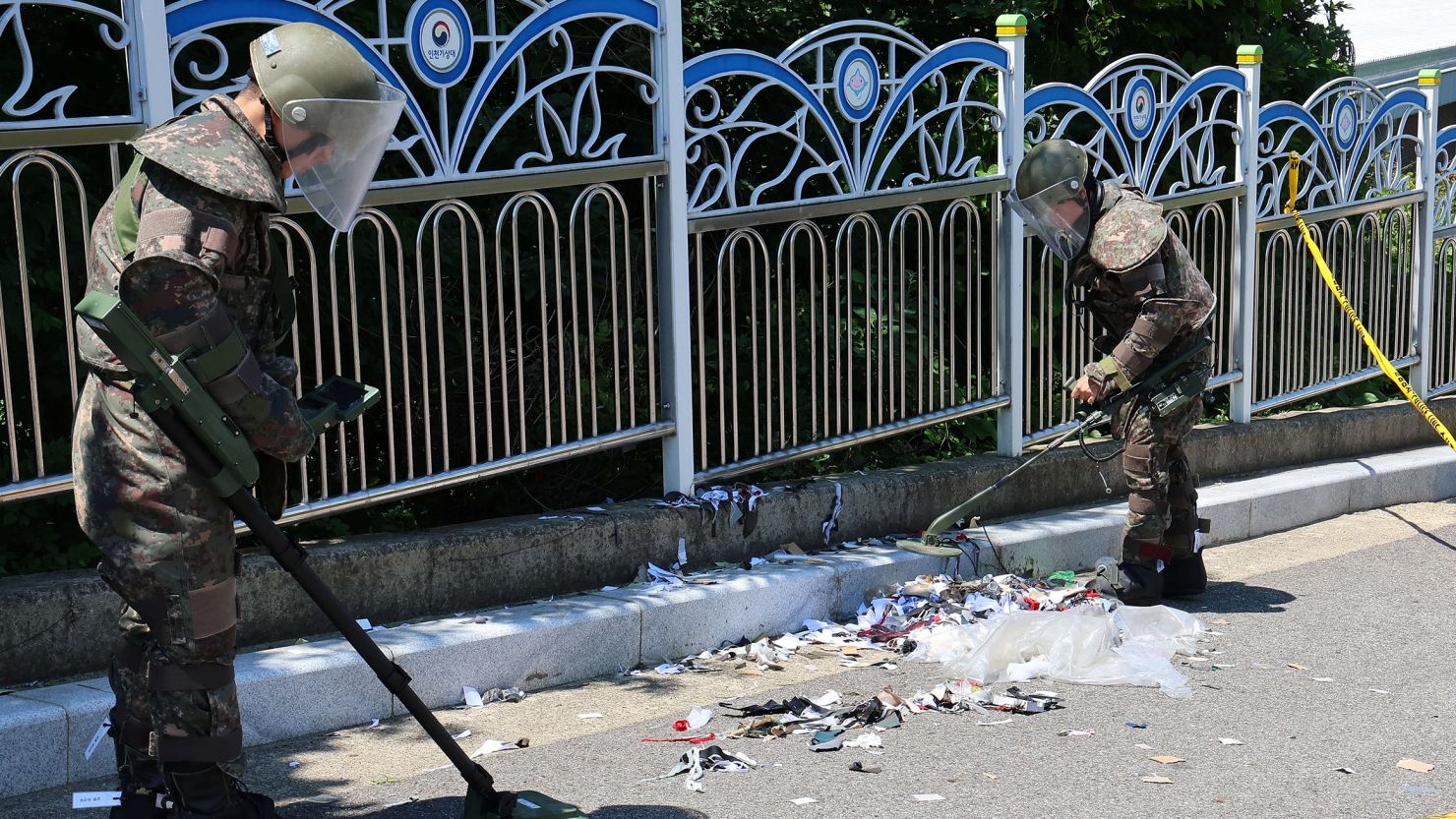 In a file photo, South Korean soldiers examine various objects of trash from a balloon believed to have been sent by North Korea, in Incheon, South Korea, on June 2, 2024.