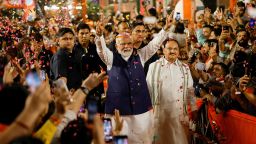 Supporters throw petals on Indian Prime Minister Narendra Modi as he arrives at Bharatiya Janata Party headquarters in New Delhi on June 4.