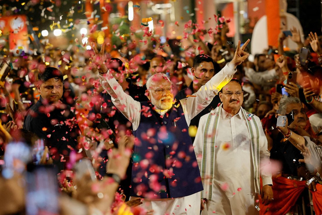 Supporters throw petals on Indian Prime Minister Narendra Modi as he arrives at Bharatiya Janata Party headquarters in New Delhi, India, on June 4, 2024.