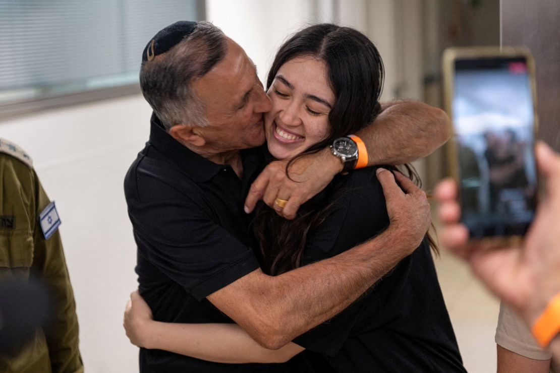Noa Argamani, a rescued hostage, embraces her father, Yakov Argamani, following her rescue, on June 8, 2024.