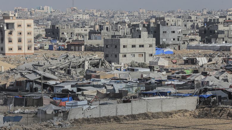Tents for displaced Palestinians are seen amidst rubble of destroyed buildings in Al-Mawasi, southern Gaza, on June 12, 2024.