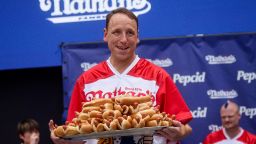 World Champion Joey Chestnut holds a platter of hot dogs ahead of 2023 Nathan's Famous Fourth of July International Hot Dog Eating Contest in Coney Island in New York City, U.S., July 3, 2023.