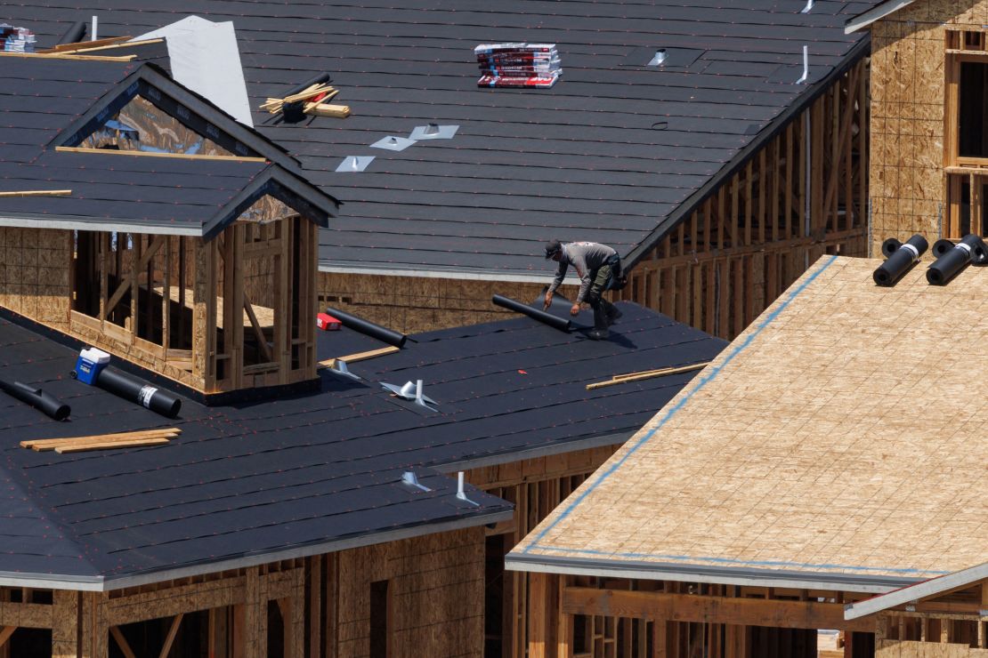 A construction worker works at a housing development in San Diego, California, on June 18, 2024.