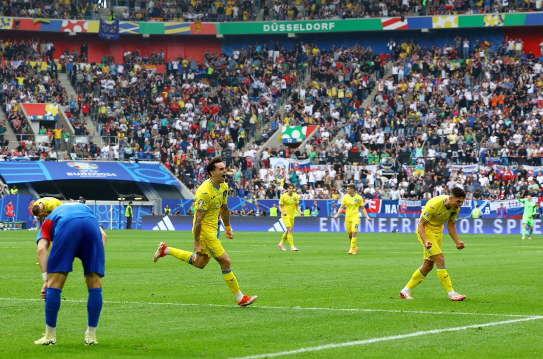 Ukraine's Mykola Shaparenko celebrates scoring his side's equalizing goal.