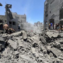 Palestinians search for casualties at the site of Israeli strikes on houses, amid Israel-Hamas conflict, in Gaza City, June 22, 2024.