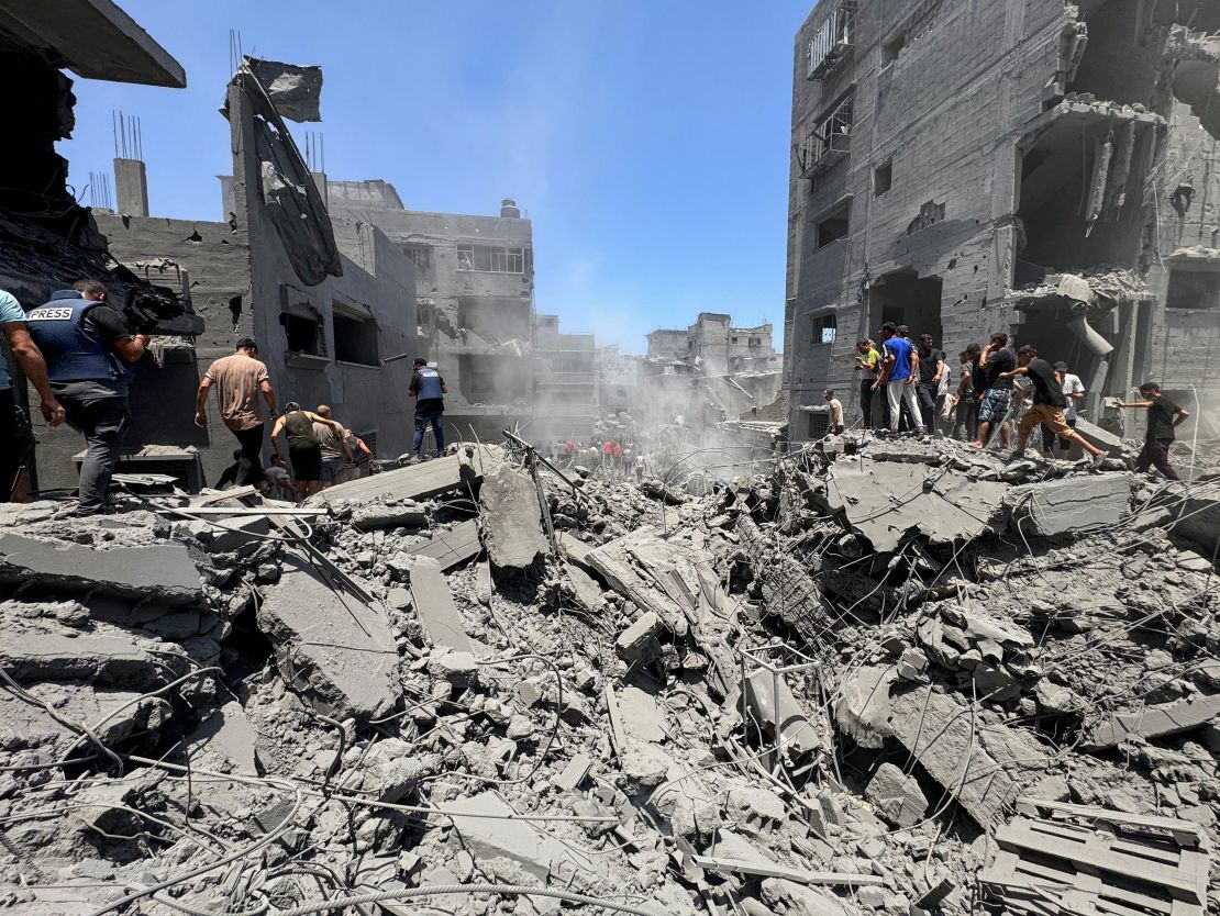 Palestinians search for casualties in Gaza City.