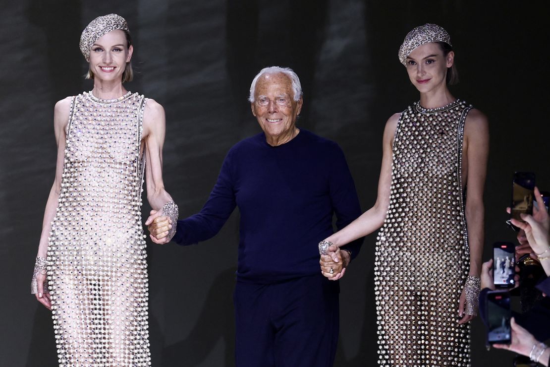 At his most recent haute couture show in Paris in June 2024, Giorgio Armani takes a bow.